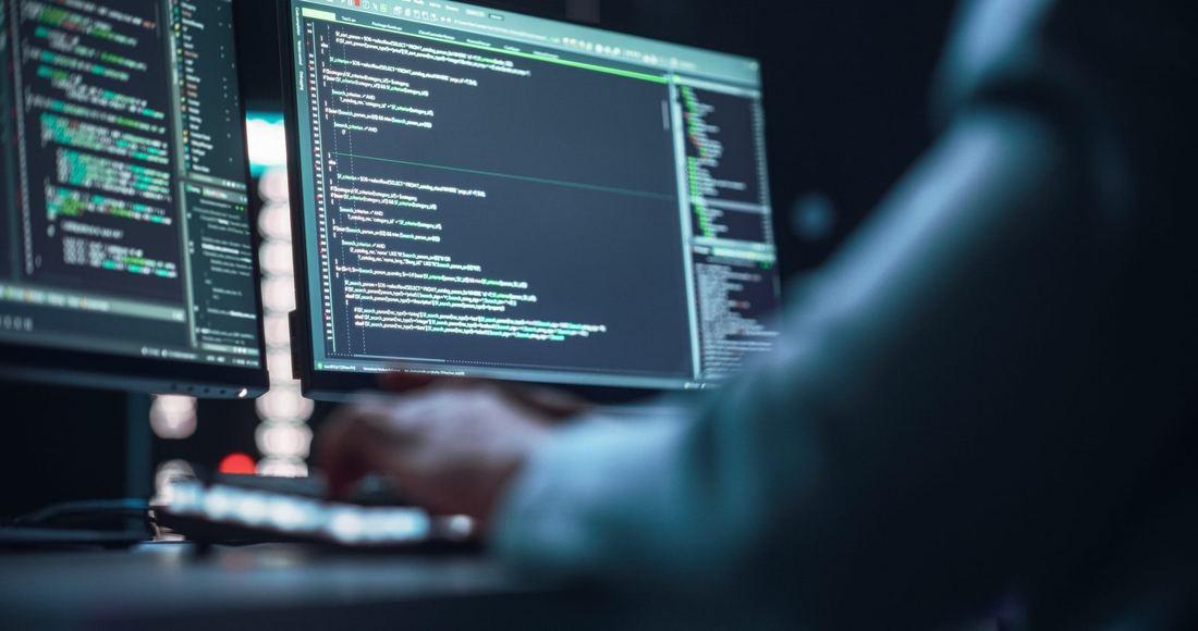 A person writing code on a computer